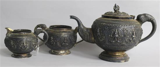 An Indian white metal three piece tea set.